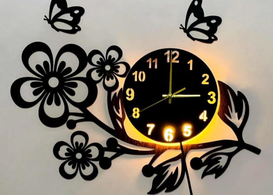 Black 3D flower wooden wall clock with butterfly silhouettes and warm LED backlight