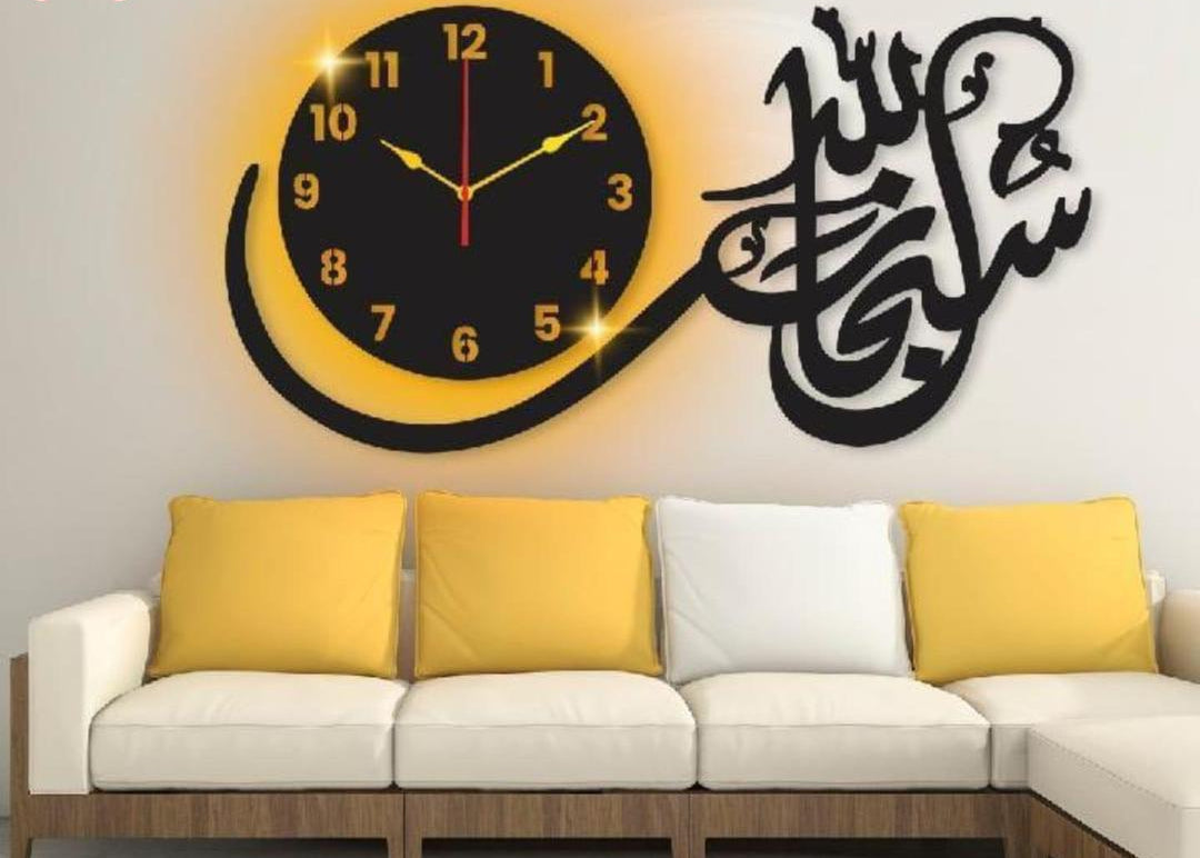 Black Subhan Allah 3D calligraphy wall clock with warm backlight above sofa