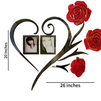 Red rose and black vine wall art with two photo frames displayed in a bedroom