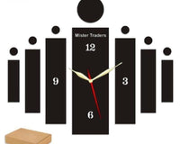 Black wall clock with staggered bars and round accents installed on a wall