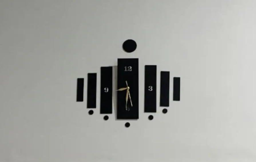 Black wooden wall clock with central hands and surrounding decorative panels