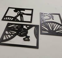Three bicycle wall art pieces displayed above a console