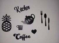 Kitchen wall art pieces displayed over a shelf