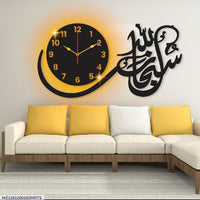 Close-up of black clock face and Subhan Allah Arabic lettering