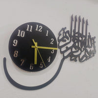 Close-up of black MDF Bismillah calligraphy wall clock with numbered face
